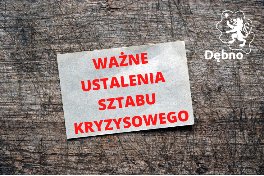 Powiększ baner. Czerwony napis Ważne ustalenia sztabu Kryzysowego na tle imitacja drewna 